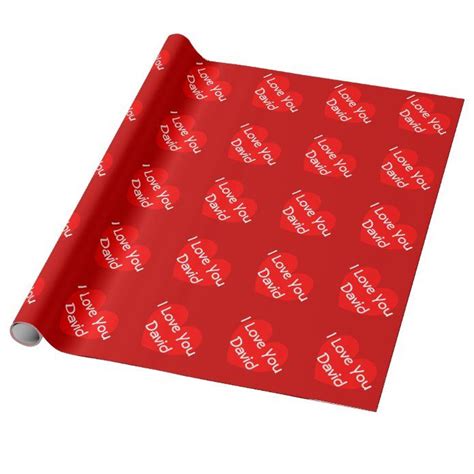 a red wrapping paper with the words happy valentine's day printed on it