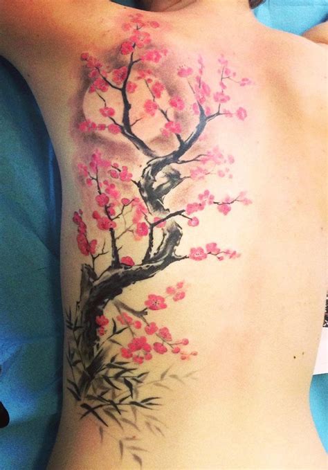 japanese cherry blossom tattoo on back - Piedad Benjamin