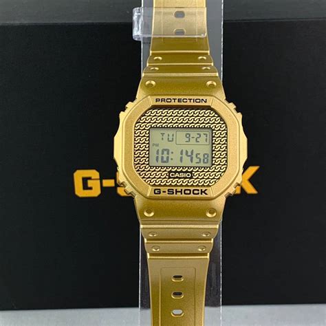 Casio G-Shock Gold Chains Inspired Themed Special Edition DWE-5600HG-1 with 2 interchangeable ...