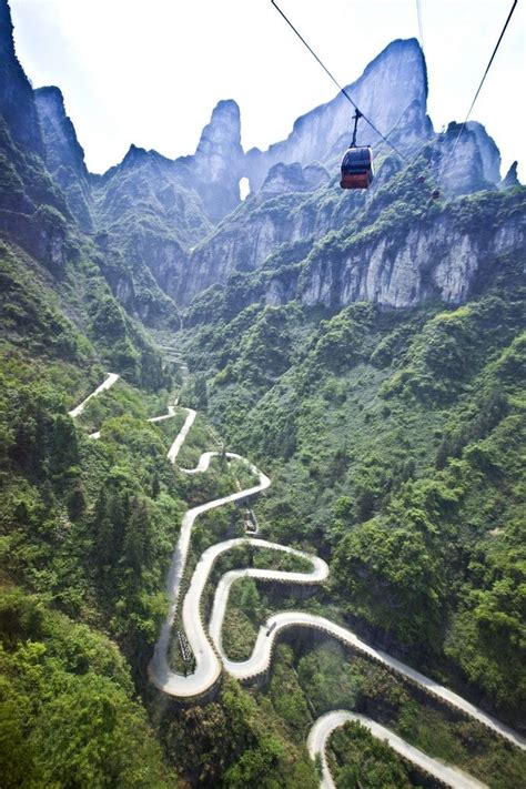 Take cable car up to the top of Tianmen Mountain and overlook the 99-blend Mountain Highway and ...