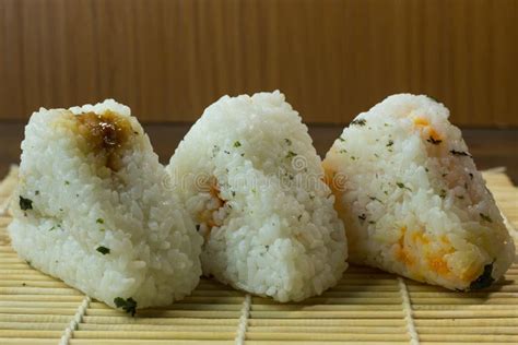 The Japanese Food Onigiri White Rice Formed into Triangular or Stock ...