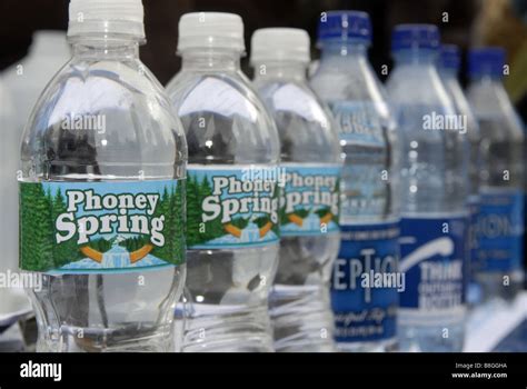 Parody bottles of water at a bottled water protest in New York Stock Photo - Alamy