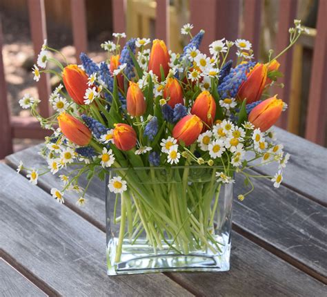 Spring flower arrangement with tulips, grape hyacinth, and chamomile. Easter Flower Arrangements ...