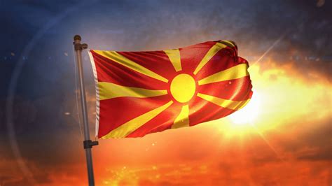 Download North Macedonia Flag During Sunset Wallpaper | Wallpapers.com