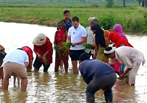 Congress leader Rahul Gandhi interacts with farmers at a farm