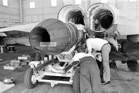 Amazon.com: Photo Aircraft maintenance technicians work on an F404-GE-400 turbofan engine prior ...