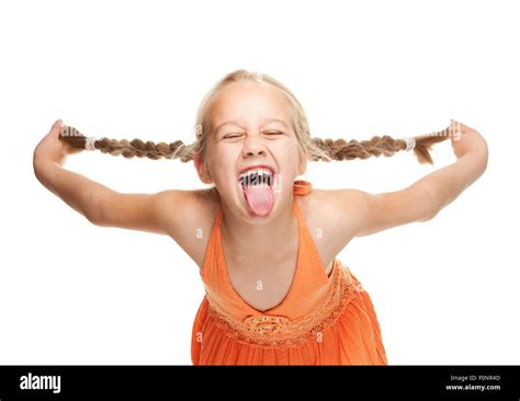 Little girl making funny face Stock Photo - Alamy