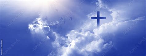 Christian cross appeared bright in the sky with soft fluffy clouds, white, beautiful colors ...