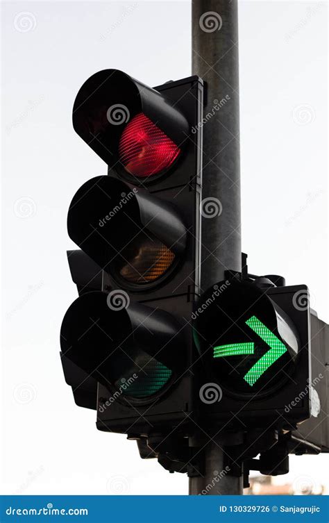 Red Color and Right Green Arrow on the Traffic Light Stock Photo ...