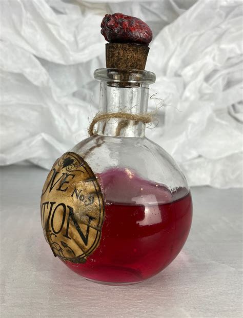 Love Potion 9 w/Shrunken Heart round bottle | Etsy