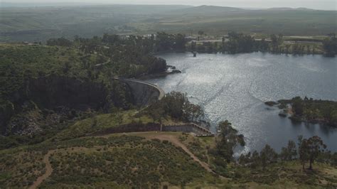 4K stock footage aerial video of orbiting a dam and Lower Otay Lake ...