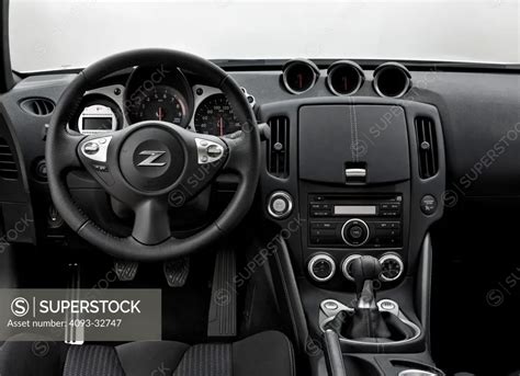 2010 Nissan 370Z Coupe interior view with wheel and dash - SuperStock