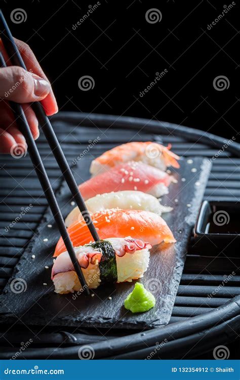 Tasting Nigiri Sushi with Rice and Shrimp on Table Stock Photo - Image of sashimi, sushi: 132354912