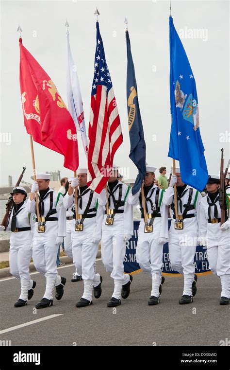 Military color guard carries flags in parade Stock Photo - Alamy