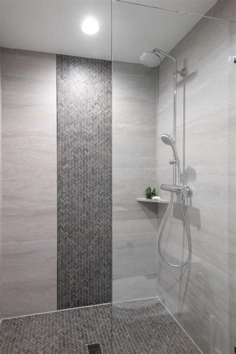 Check out this sleek walk-in shower with a herringbone mosaic tile floor on HGTV.com. | Bathroom ...