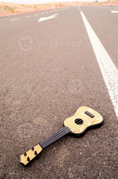 Acoustic guitar on the road 17472701 Stock Photo at Vecteezy