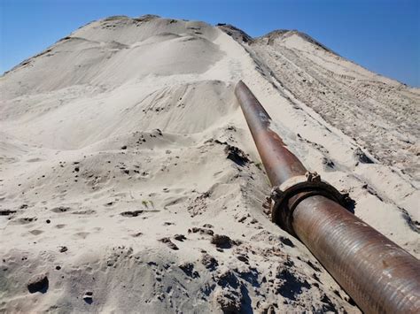 Premium Photo | Alluvium and extraction of sand from the dnieper river. dredger operation method