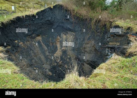 Collapsed mineshaft on development land at Hoel Gerrig Merthyr Tydfil Stock Photo: 16398605 - Alamy