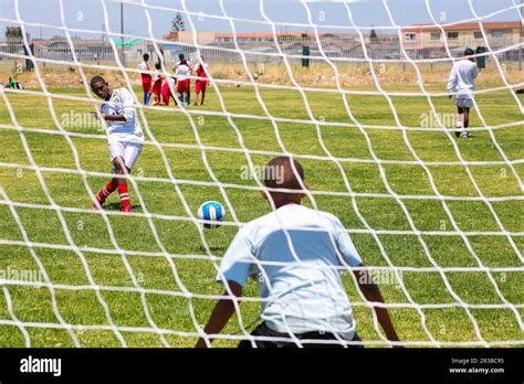 Diverse children playing soccer football at school Stock Photo - Alamy