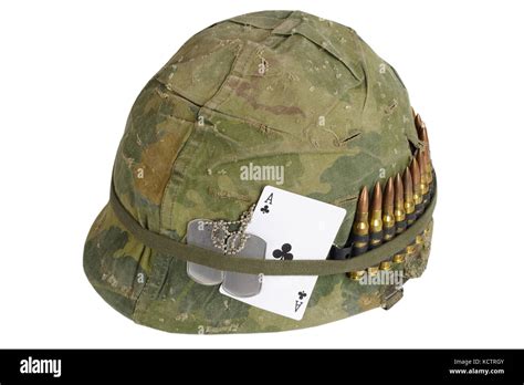 US Army helmet Vietnam war period with camouflage cover and ammo Stock ...