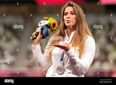 Silver medalist Maria Andrejczyk, of Poland, poses on the podium during ...