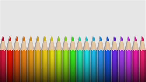 Premium Vector | Rainbow colored pencils lie in a row on a white background