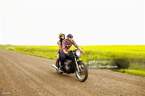 Hip Young Couple Riding On Motorcycle High-Res Stock Photo - Getty Images