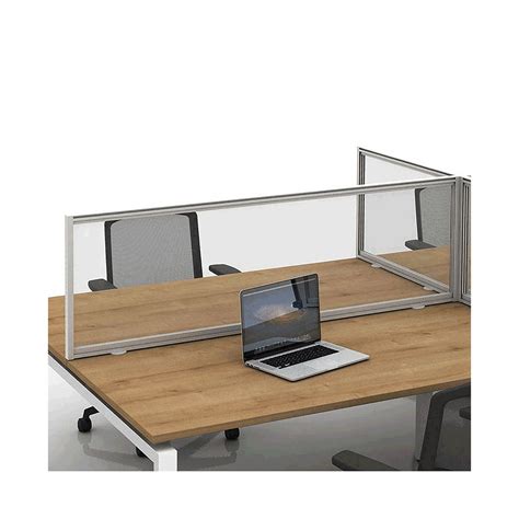 an office desk with a laptop on it