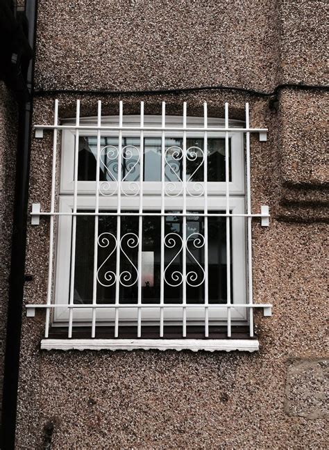 Delighted client with our RSG2000 window security bars fitted to his house in Greenford ...