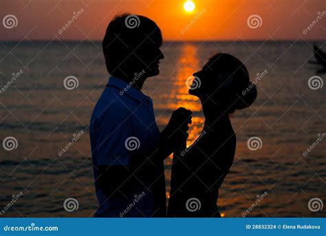 Romantic Young Couple Sunset Silhouette on Beach. Stock Photo - Image ...