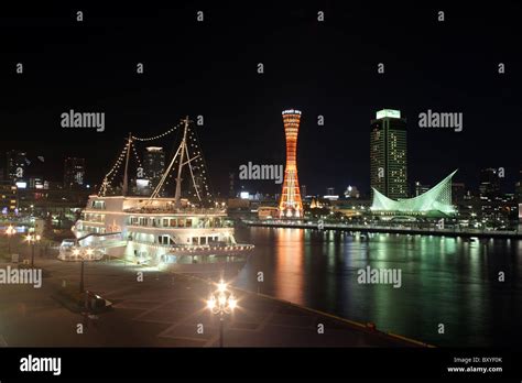 Night view of Kobe Harbour with large ship, port tower and maritime ...