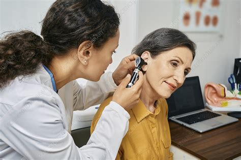 Ear examination - Stock Image - F034/9095 - Science Photo Library