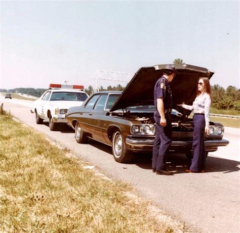 Louisiana State Police assisting a motorist on the freeway in the 1970s ...