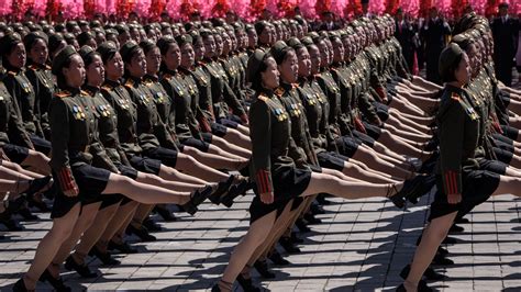 North Korea hosts military parade free of advanced missiles, focused on the economy
