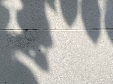 Premium Photo | Shadows on a wall with the word love on it