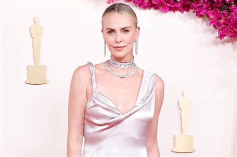 Charlize Theron Wears Silver Dress and Tons of Jewels at the 2024 Oscars