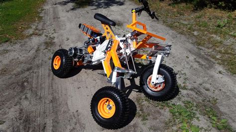 Tilting electric quad gets menacing off-road big brother