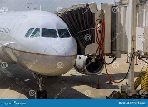 Boarding Bridge Jetway Connected To the Airplane for Boarding Passengers Stock Image - Image of ...