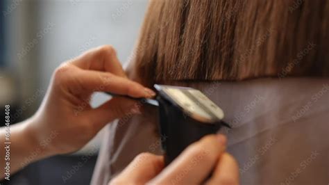 Closeup styling even line of hair with clipper in slow motion. Close-up ...