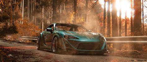 Green Toyota Supra on wooded road 4K wallpaper download