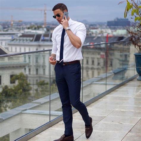 Classic Look: Crisp White Shirt, Navy Suit Pants And A Navy Tie