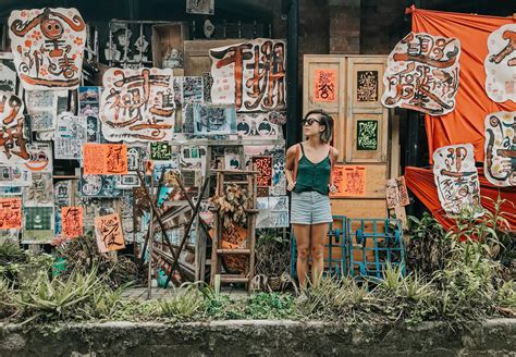 Woman Standing in Front of Paintings · Free Stock Photo