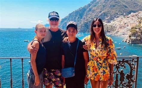 Flavio Briatore strikes a pose beside his children