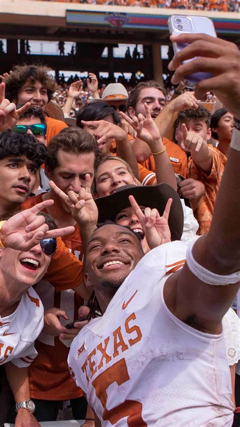 Bijan Robinson with fans after Texas vs OU - Horns Illustrated