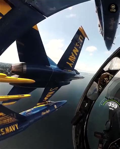 Cockpit view from US Navy F-16 Blue Angels as they fly in formation.