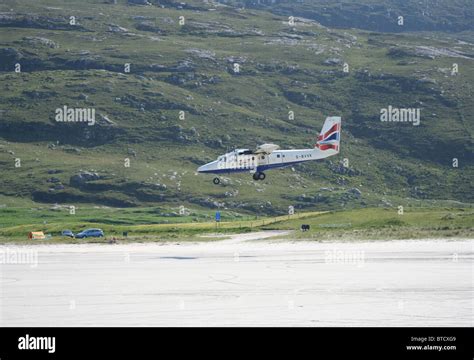 propeller plane landing on beach runway Barra airport Isle of Barra ...