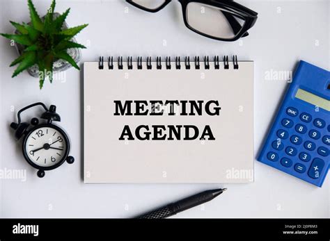 Meeting agenda text on notepad with office concept background Stock ...