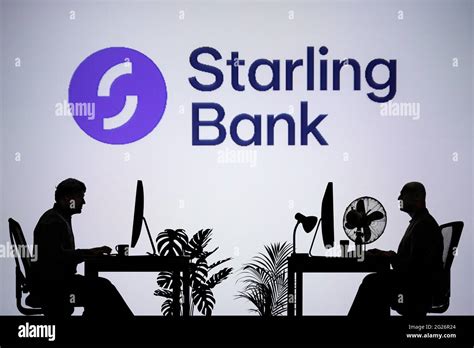 The Starling Bank logo is seen on an LED screen in the background while ...