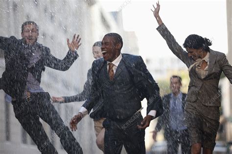 Enthusiastic business people running - Stock Image - F014/0460 - Science Photo Library