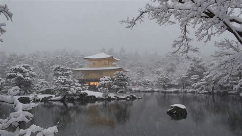 Kyoto, Japan - Kinkakuji Golden Pavilion Japanese Zen temple overlooking a large pond during ...